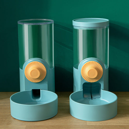 Clear gravity water bottle hanging dispenser attached to a white wire pet cage.