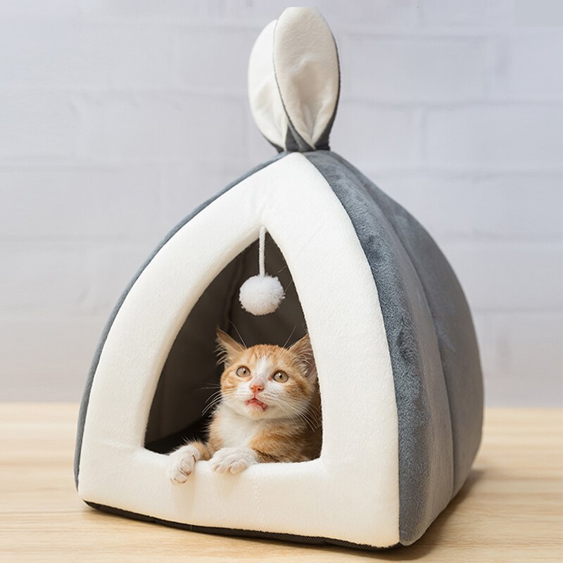 Enclosed warm fleece winter pet house cave bed with a removable inner soft cushion.